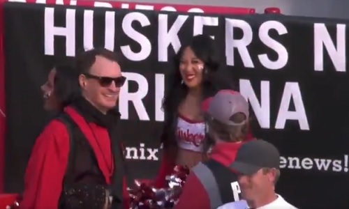 Nebraska cheerleader gets bonked on the head with football as QB throws pass away (video)