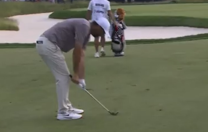 Scottie Scheffler smashes club on the golf course
